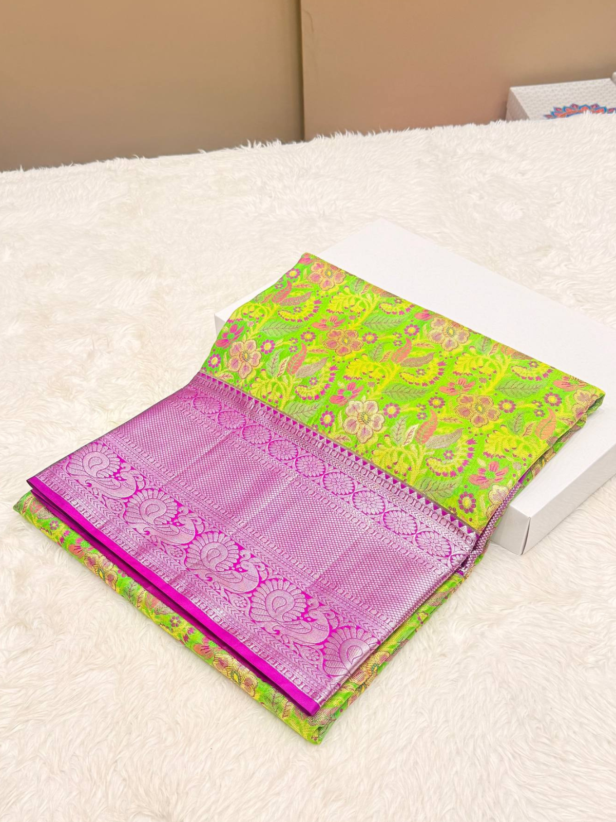 Elegant parrot green Kanchipuram silk saree with rich zari brocade and a contrasting pink peacock border